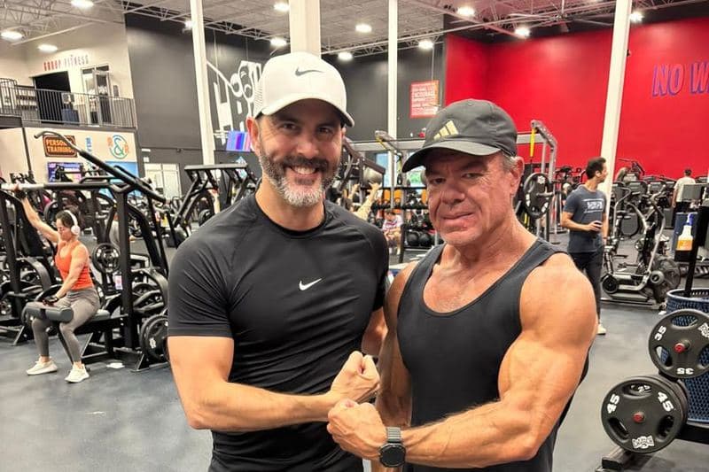 Jeff Mensing standing shoulder to shoulder with a training partner on the gym floor